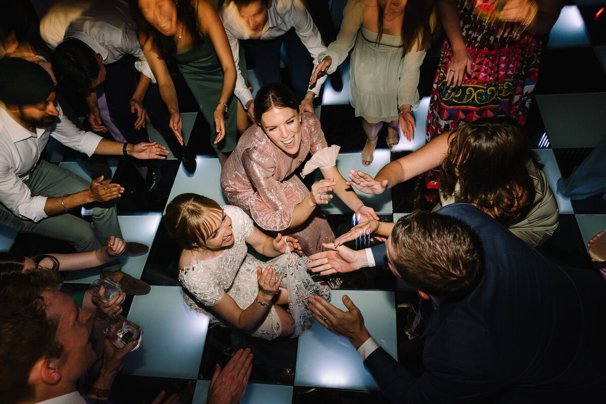 Large group of friends getting low on the dance floor