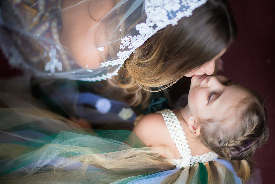bride_kissing_flower_girl_wedding_photography_zolu