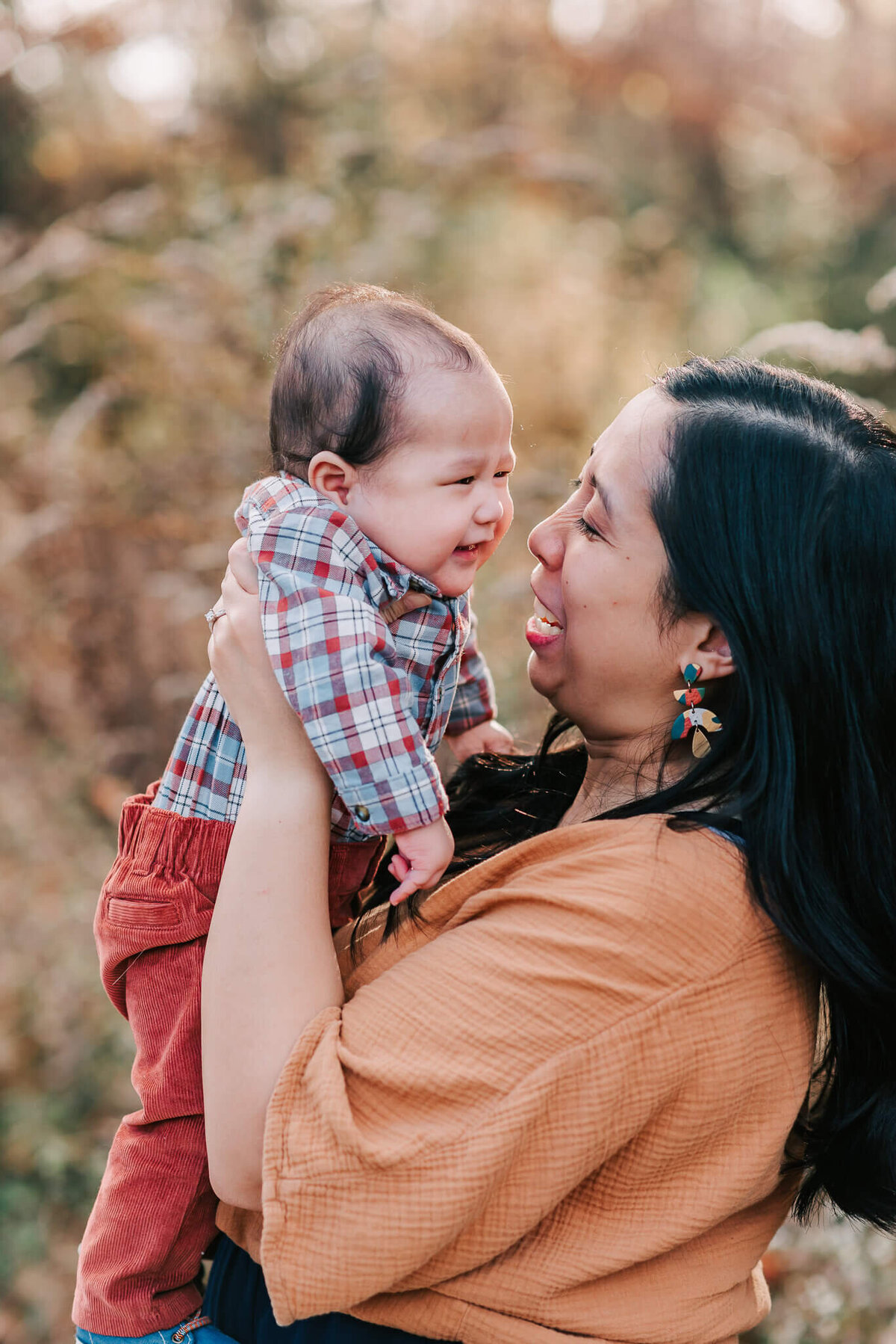 A sweet baby giving his mama a smile during their family session in Northern Virginia