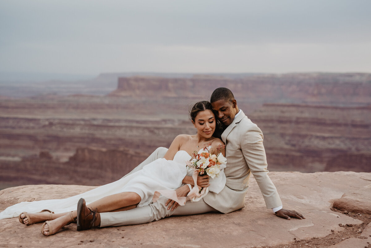 Utah Elopement Photographer captures couple cuddling during portraits
