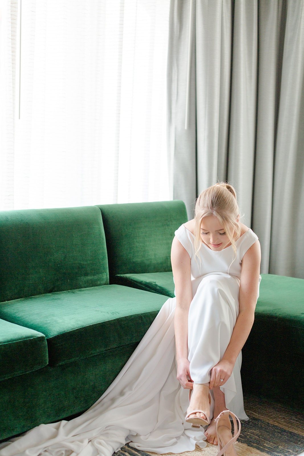 Bride getting ready in a hotel in Aspen Colorado by Kelby Maria Photography