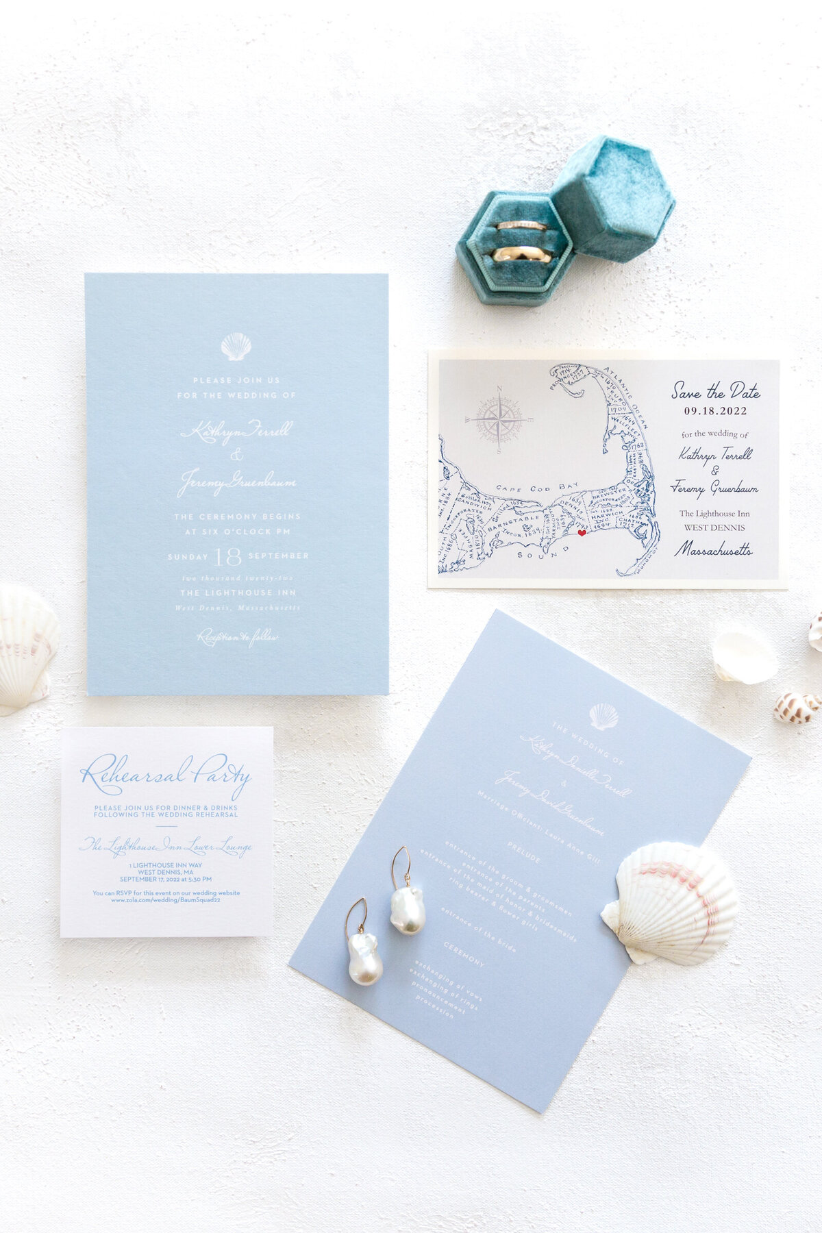 Close up of blue and white beach  wedding invitations