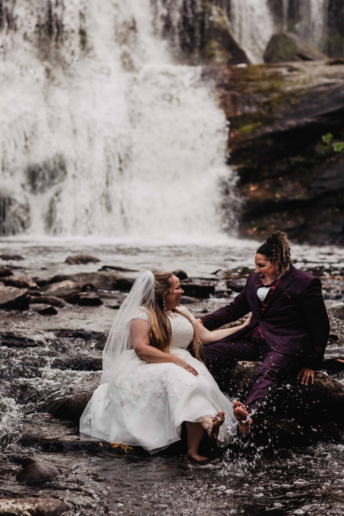 LGBT adventure elopement at waterfall in Tennessee photographed by Magnolia and Ember.