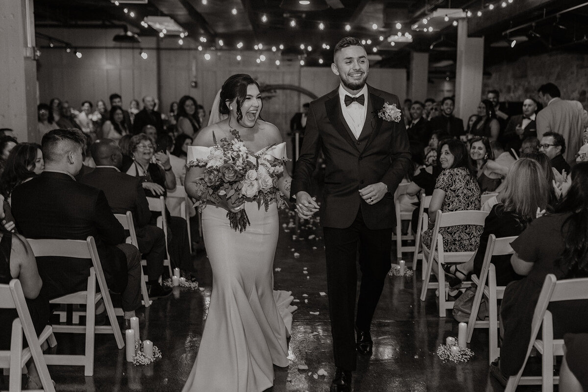 Bride and groom walking down the aisle