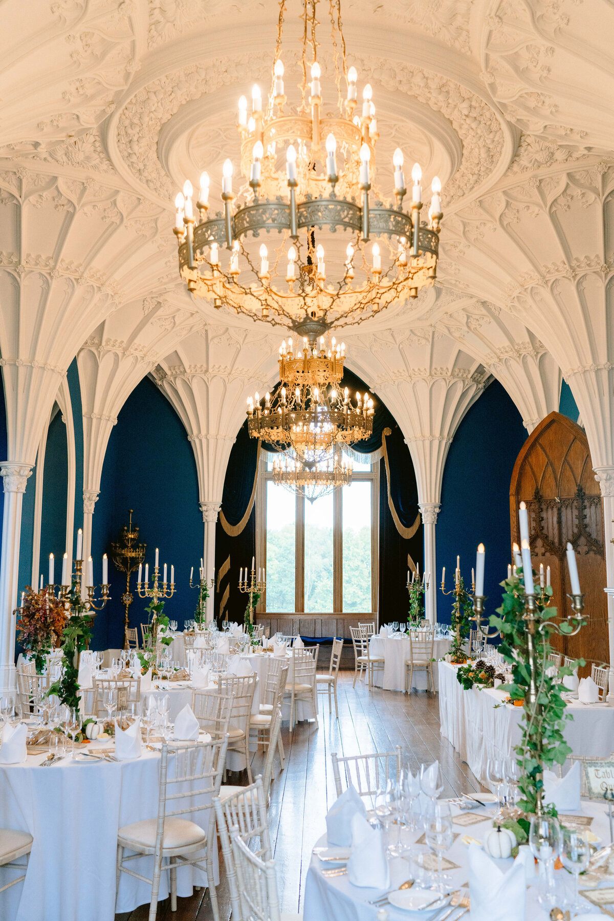 the allerton castle ballroom laid out for a wedding breakfast. a gothic room