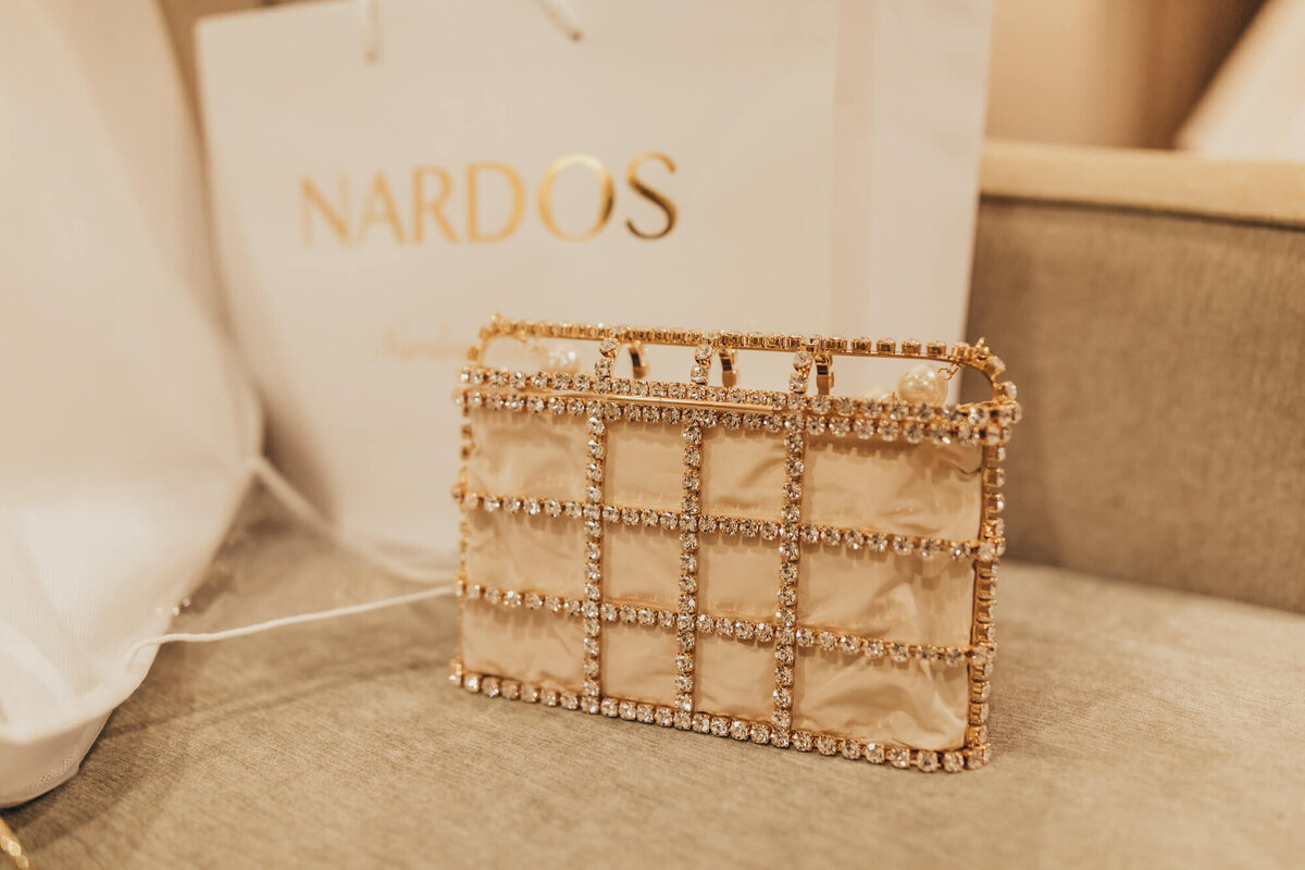 designer Nardos gold studded clutch bag.