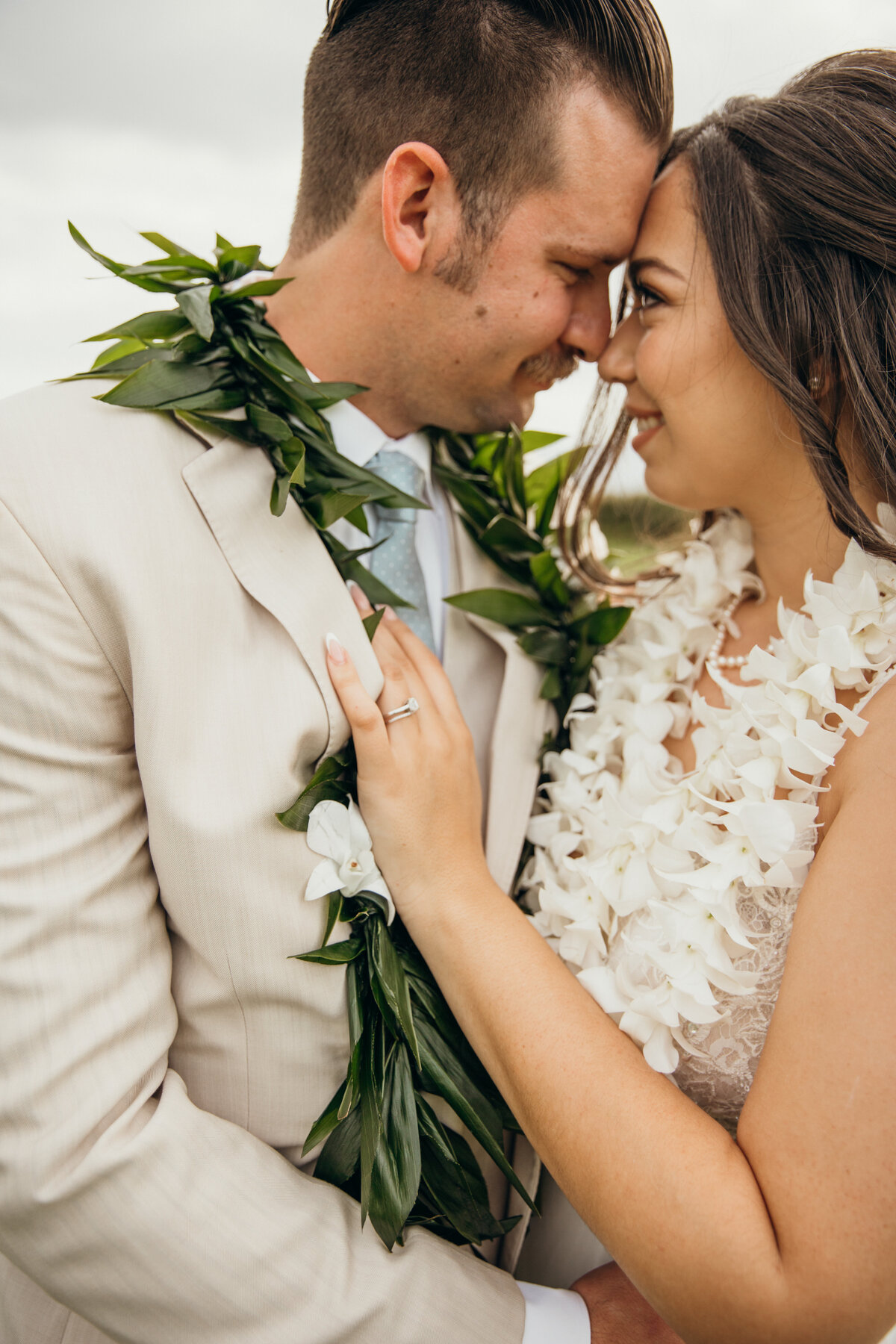 Maui Wedding Photographer captures bride and groom touching foreheads after Maui beach wedding