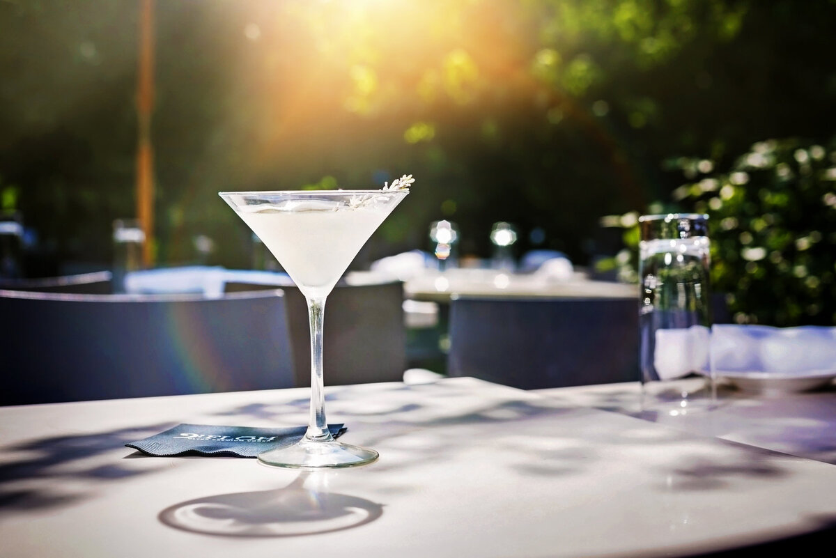 Advertising food photograph of a martini on a patio