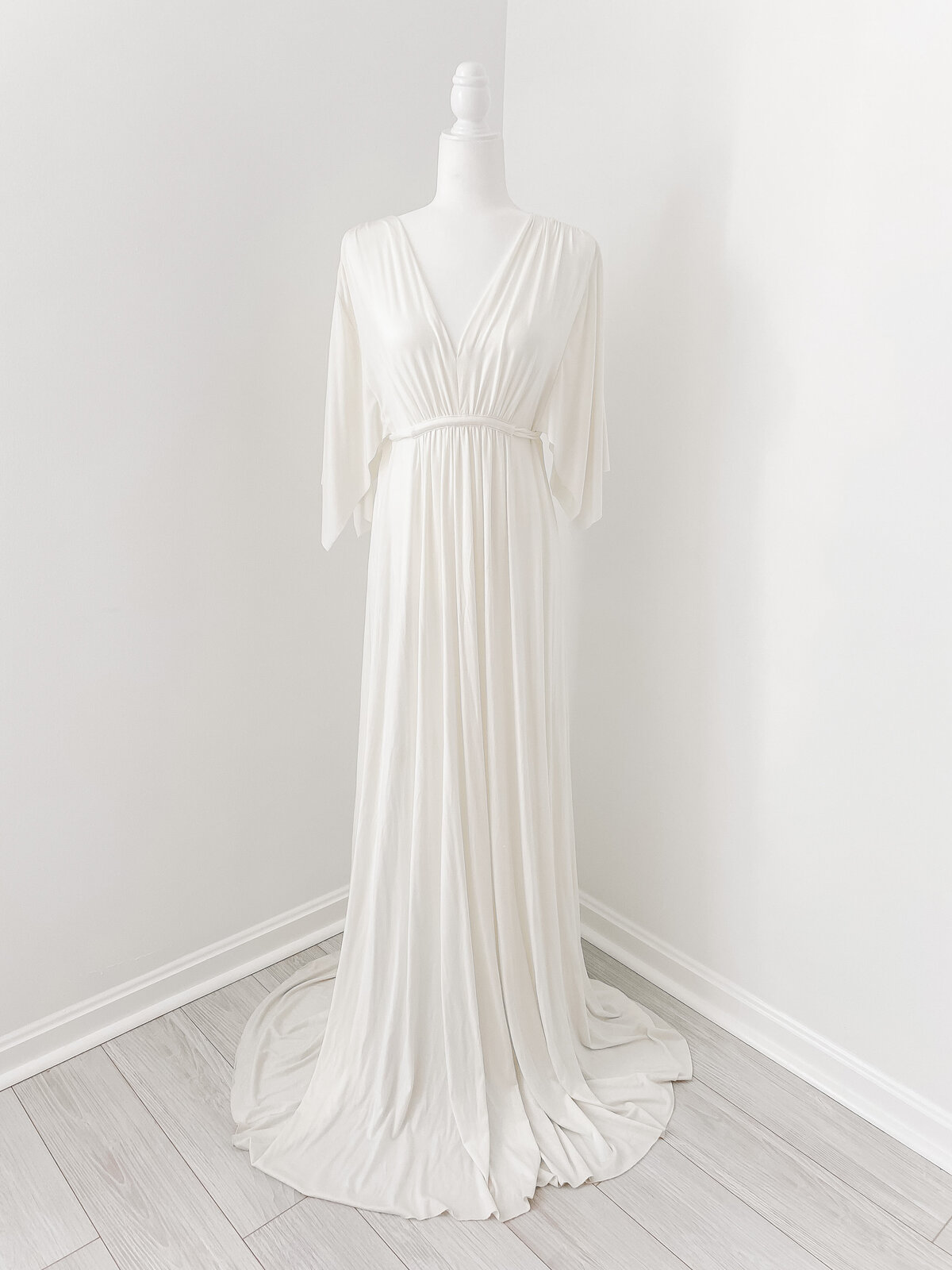A stunning white long dress with a deep V cut to wear for your photoshoot with Northern Virginia Maternity Photographer
