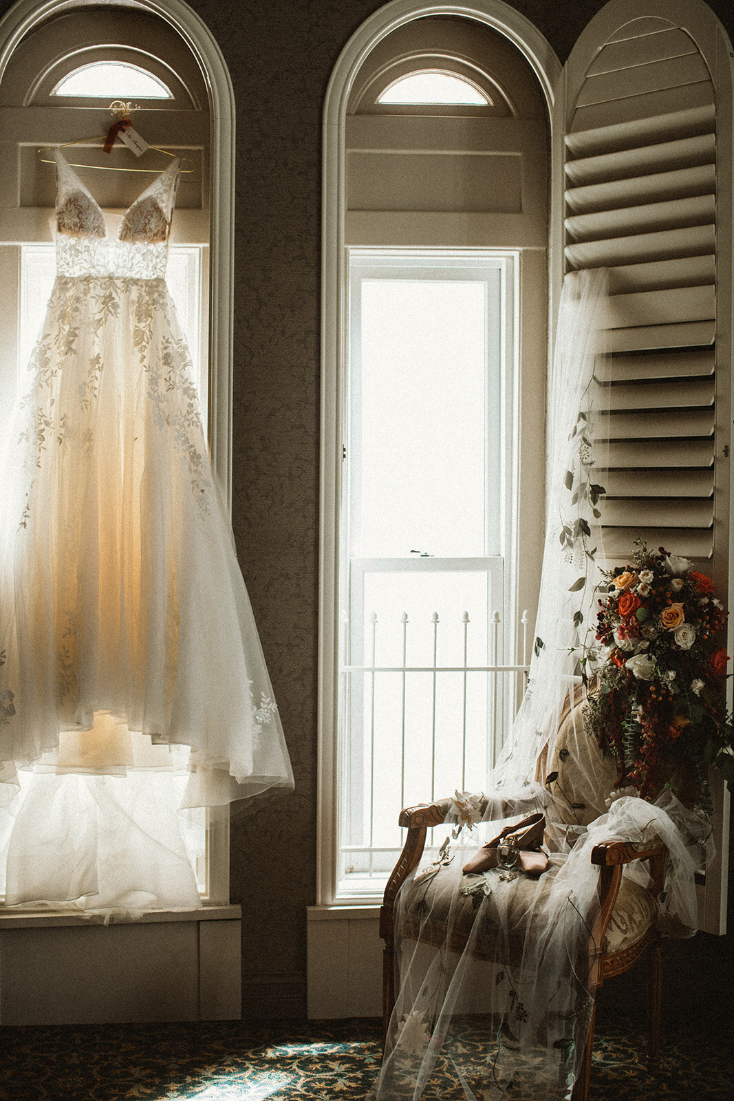 wedding dress and flowers in window