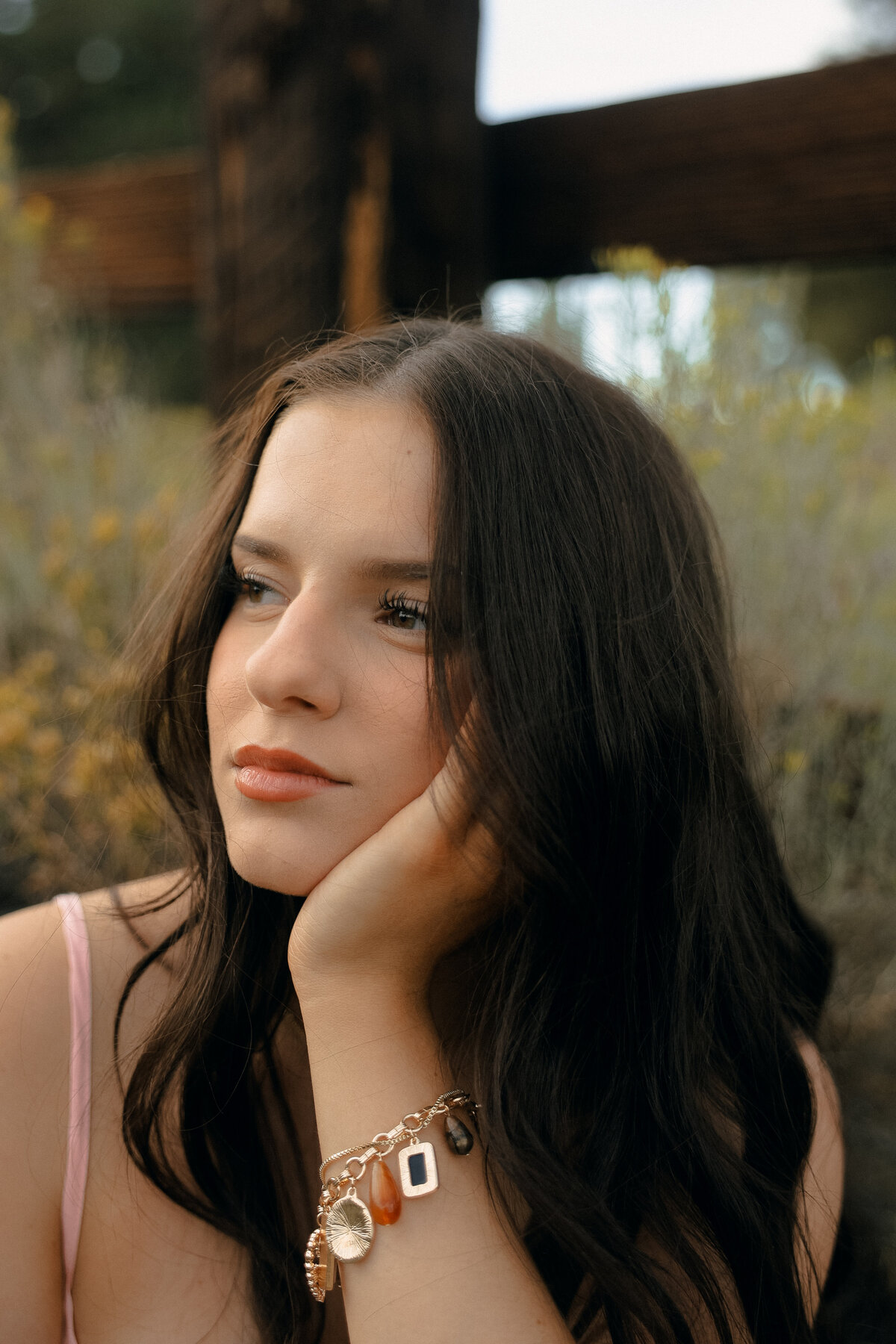 Senior Portrait by River in Light Blue Dress with Mountain Backdrop