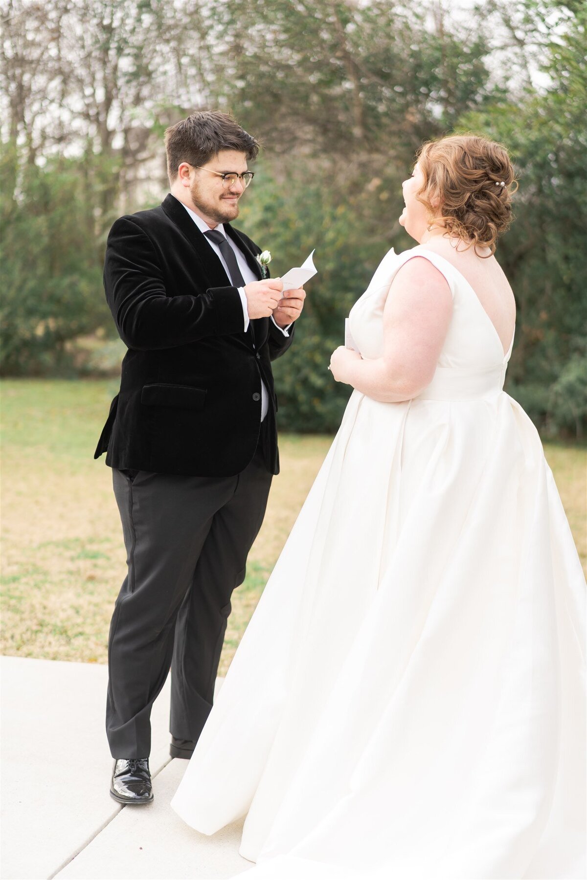 Groom reads his vows to his bride on their wedding day.