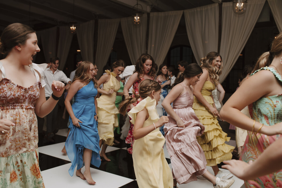 guests dancing on checkered dance floor