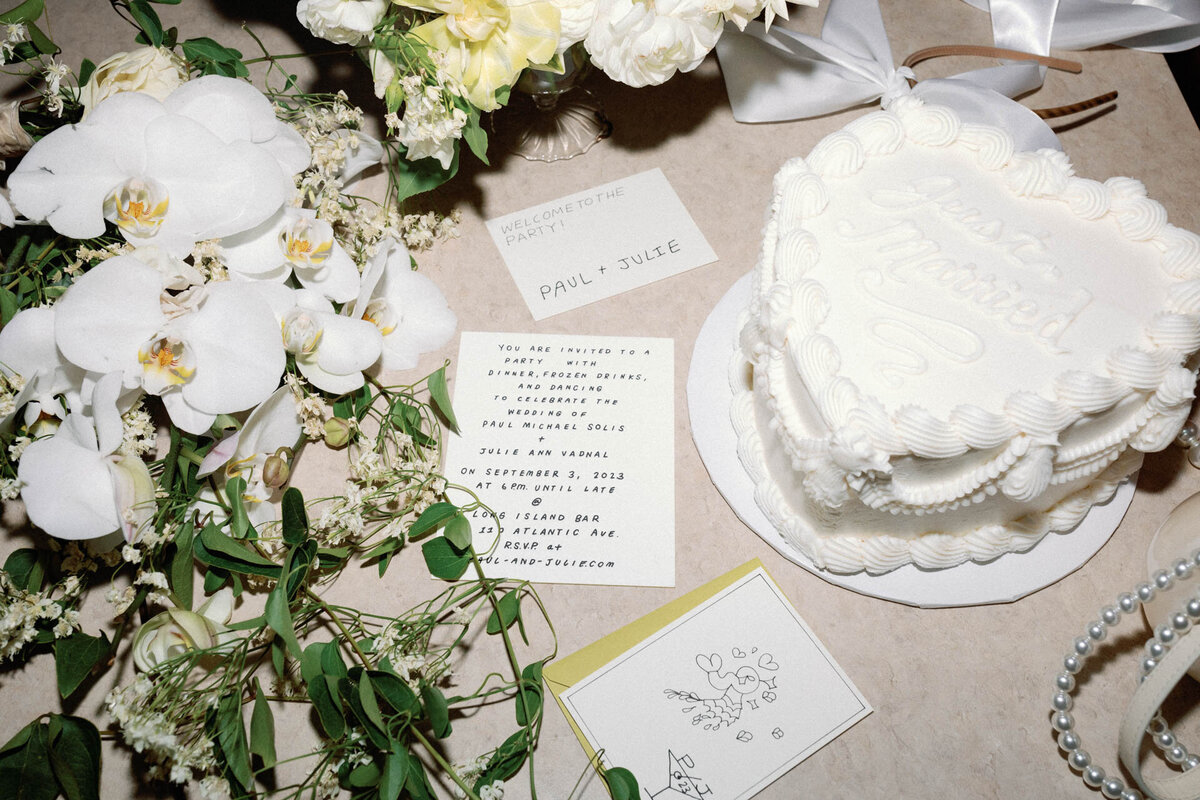 Brooklyn wedding details at Long Island Bar with white heart cake and hand lettering