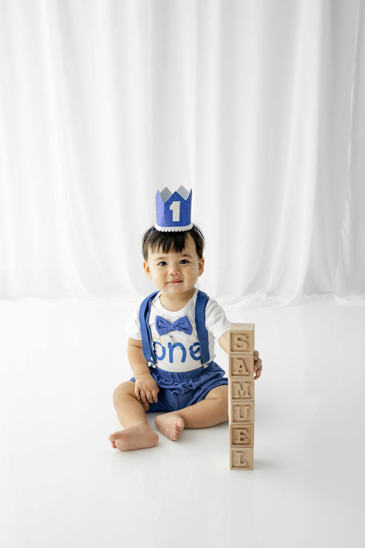 Boy in birthday outfit during themed cake smash session— captured by Alliston and Barrie cake smash photographer.
