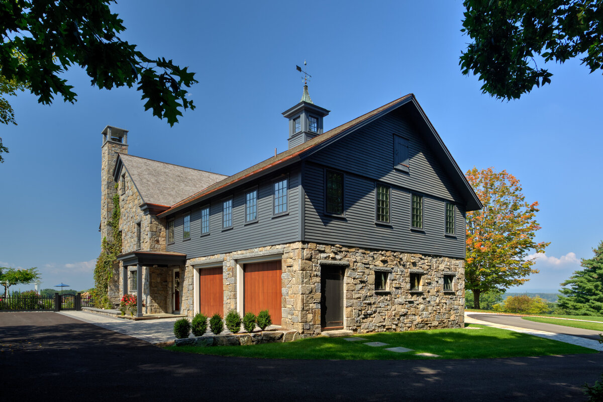 exterior view of brick house with gray paneled accents
