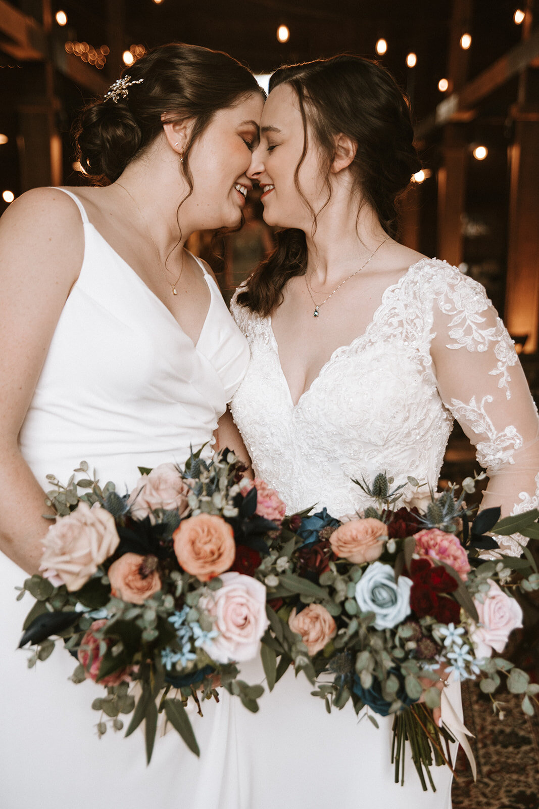 Two brides with faces touching