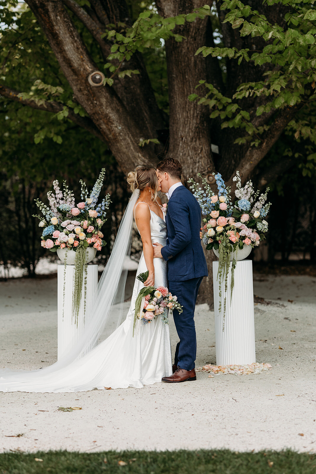 Bride and groom ceremony kiss at Poachers Pantry