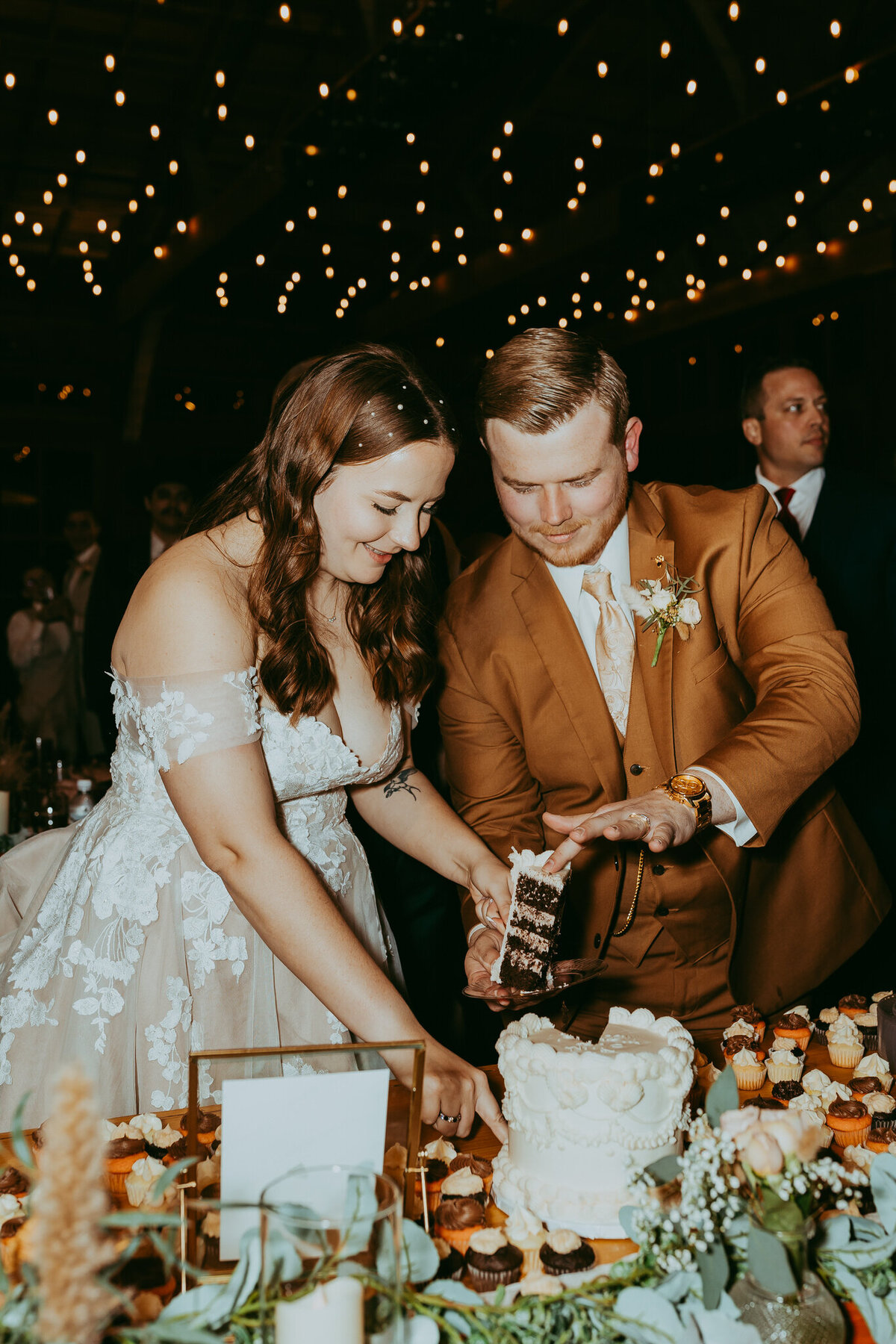 couple cutting cake at wedding