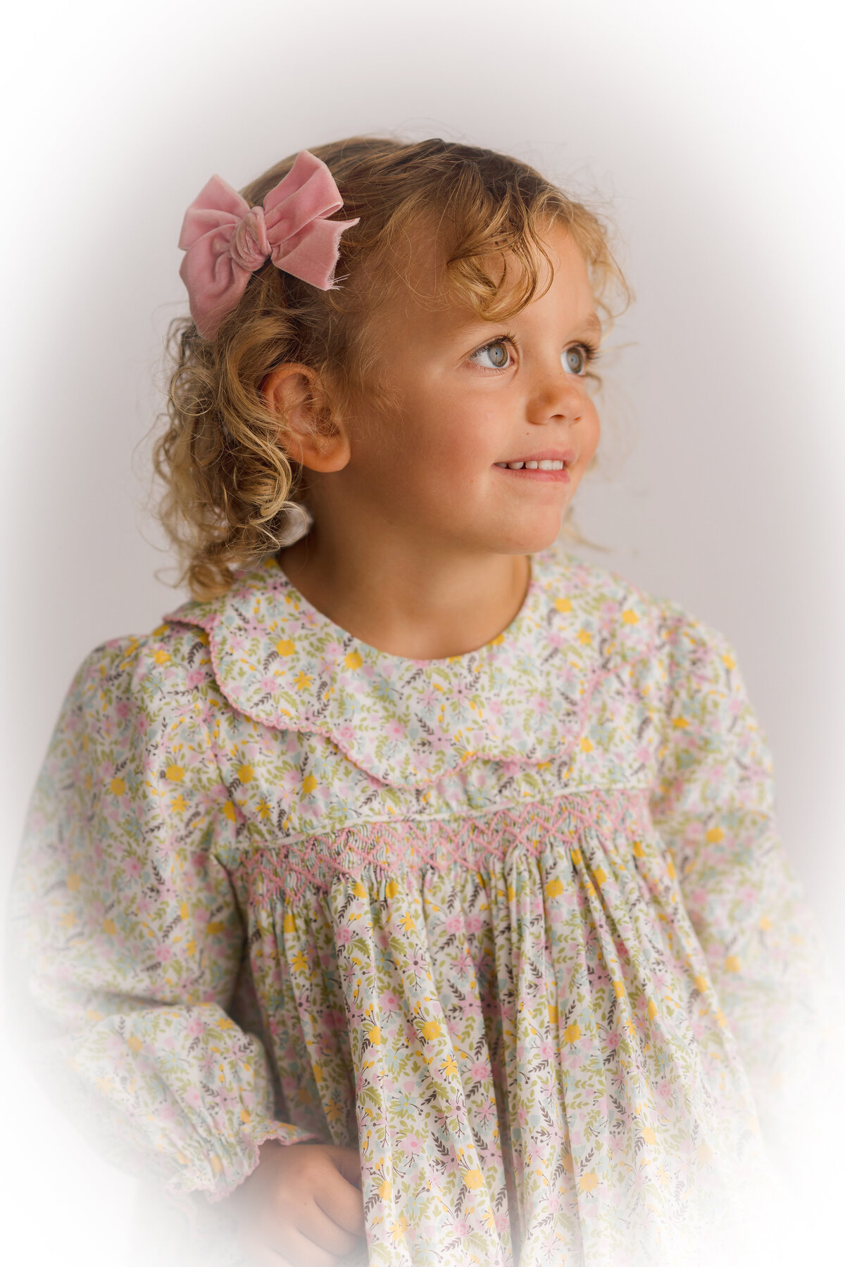 Young girl poses for Heirloom Portraits in Charleston, SC.