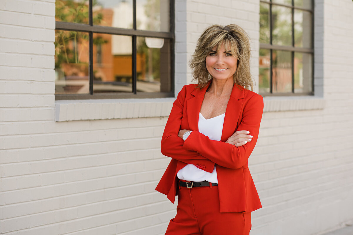 A professional from First National Bank of OMaha poses for a headshot in Old Town Fort Collins.
