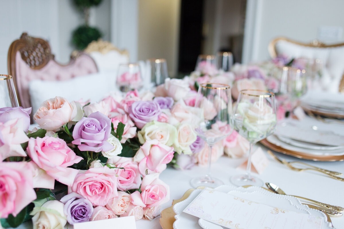 Wedding flowers on table by Riley James.
