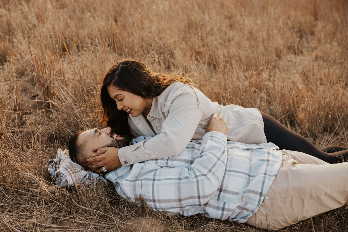 open-feild-intimate-candid-couple-engagement