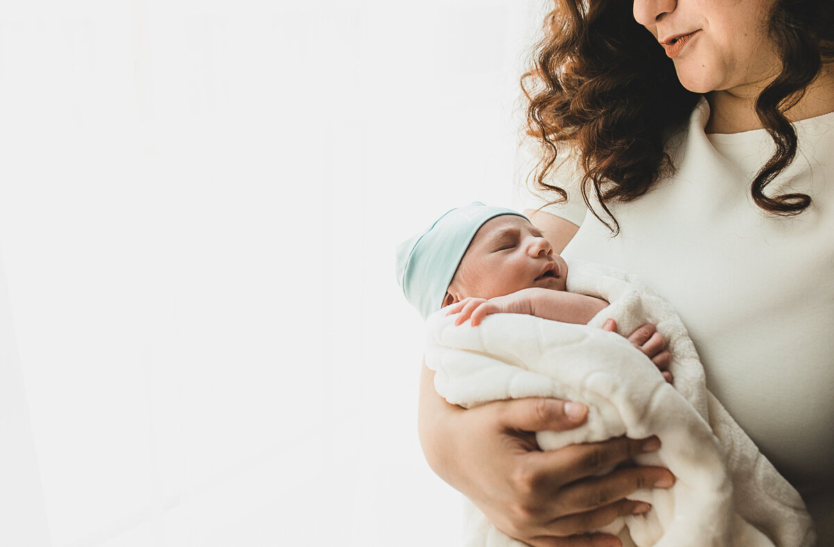 Mom holding new born baby,