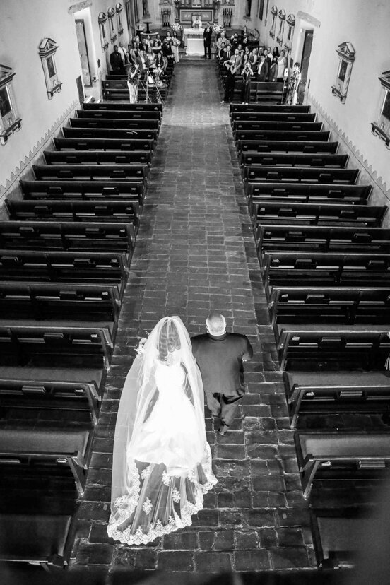 bride-and-father-walking-down-aisle-at-mission-san-diego-de-alcala-wedding
