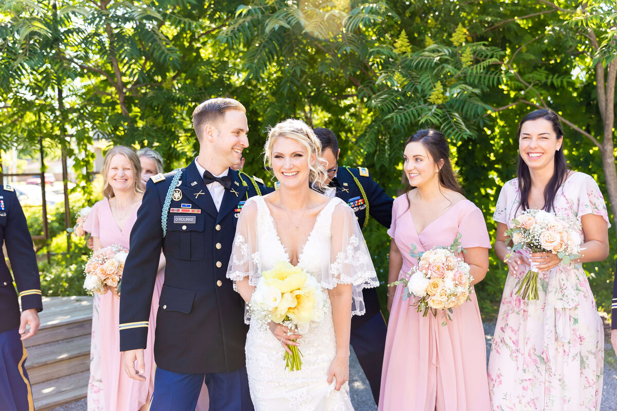 Bride and groom with bridesmaids walking behind them at Fat Bottom Brewery wedding in Nashville, TN