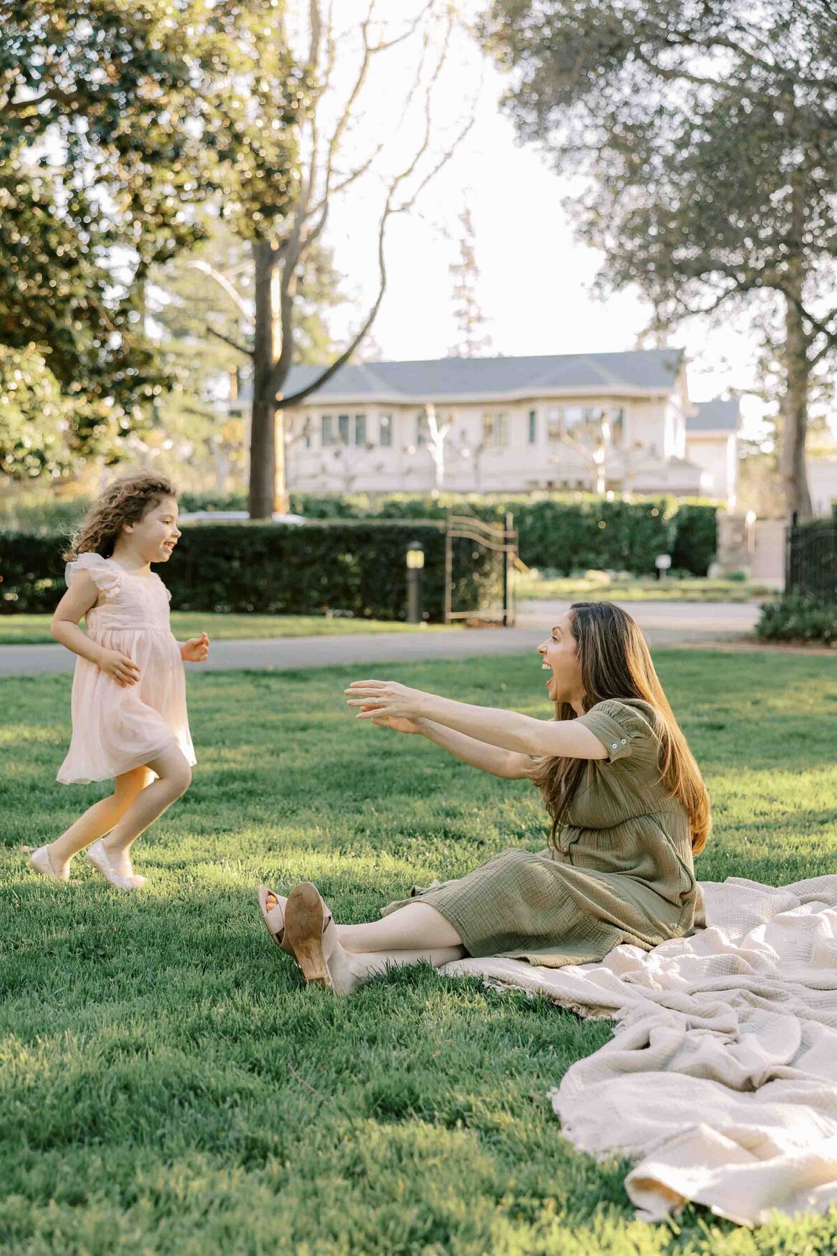 daughter running to mom in garden