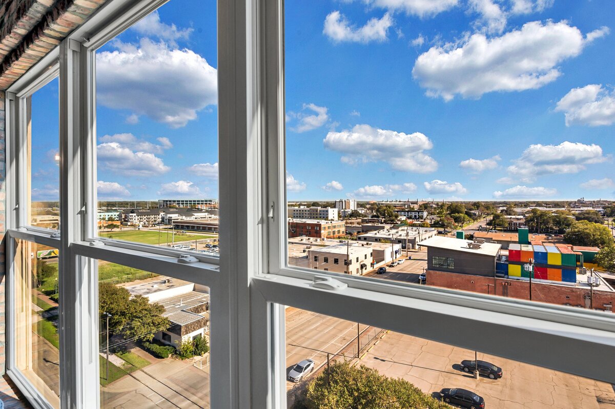 Incredible view of Baylor University and McLane Stadium from this top floor two-story industrial condo in the historic Behrens building with skyline views, fully stocked kitchen and room for 6 in downtown Waco, TX,