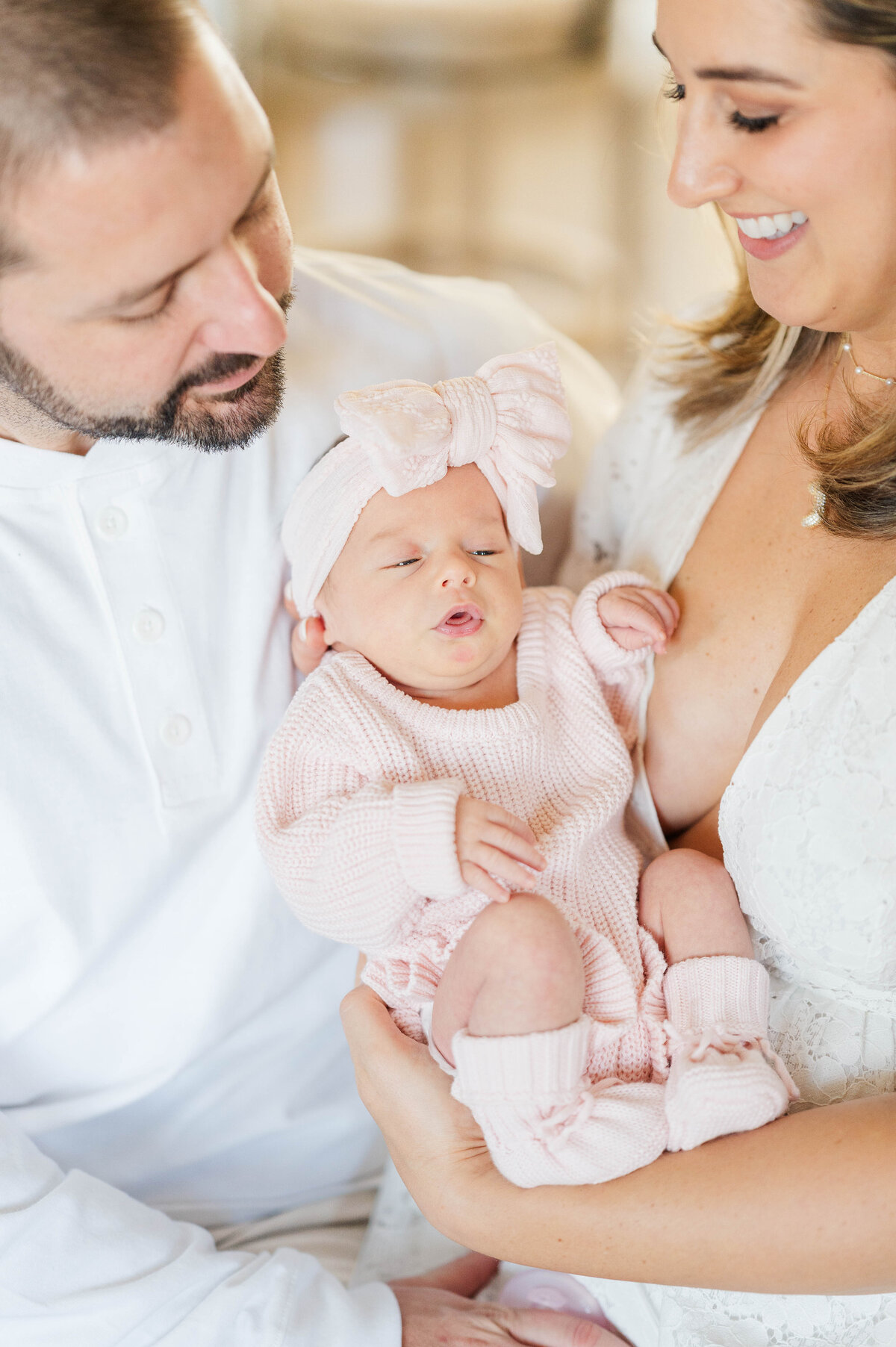 Newborn with mom and dad close up taken in Douglas, MA by the best newborn photographer in central Massachsuetts