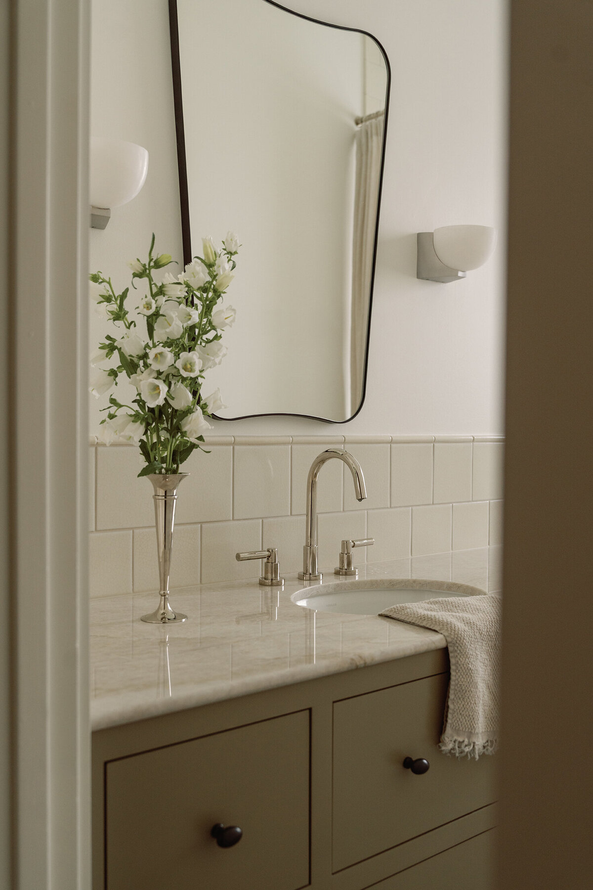 House-Franc-historical-bathroom-remodel-renovation-green-bronze-vanity-taj-mahal-quartzite-countertops-nickel-bell-flowers-fireclay-tile-crackle-tile-traditional-modern-bathroom-phylrich-bronze-knobs-warm-cozy-austin-texas