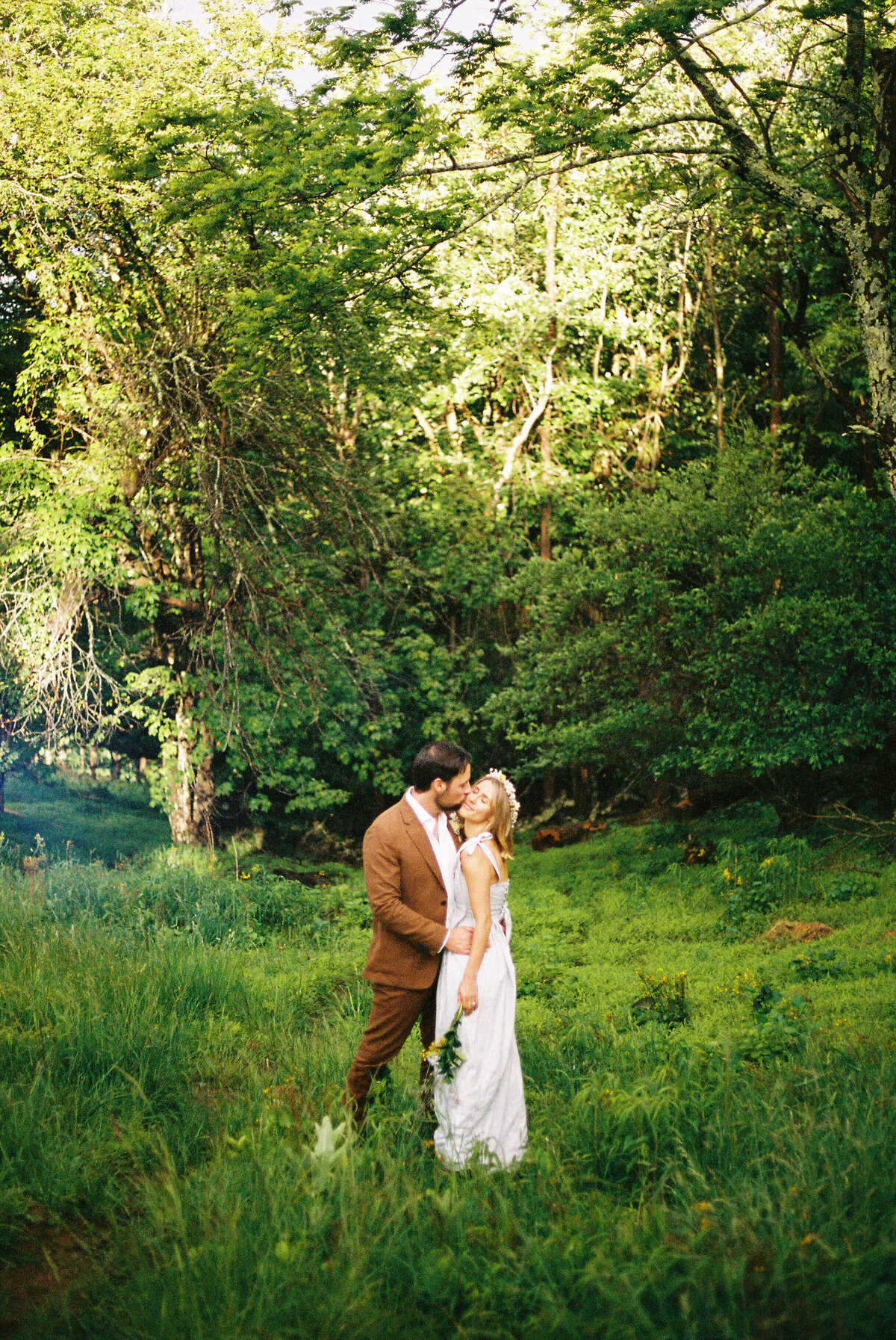film photo of couple in field