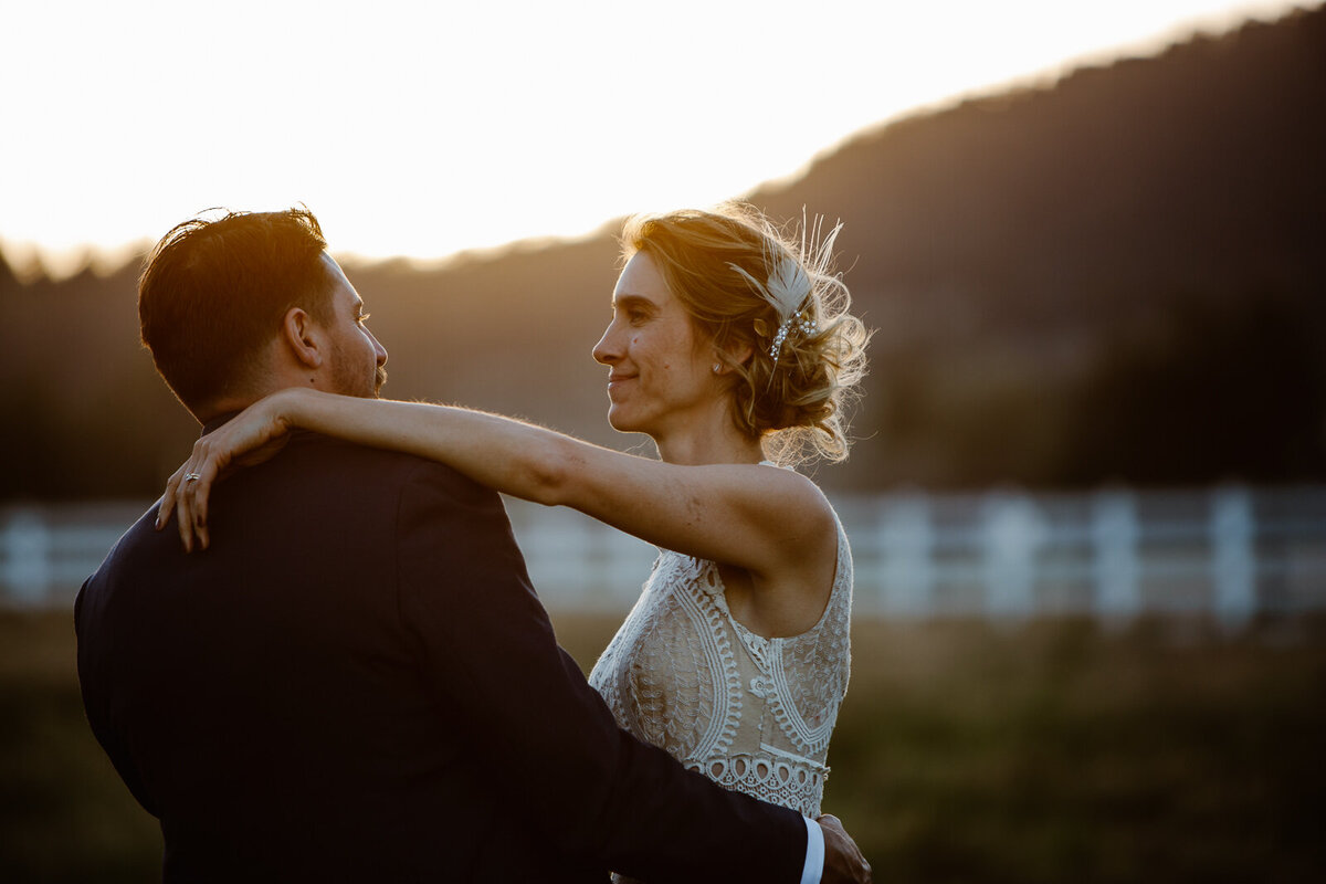 Ali looks into Brian's eyes on their wedding day.