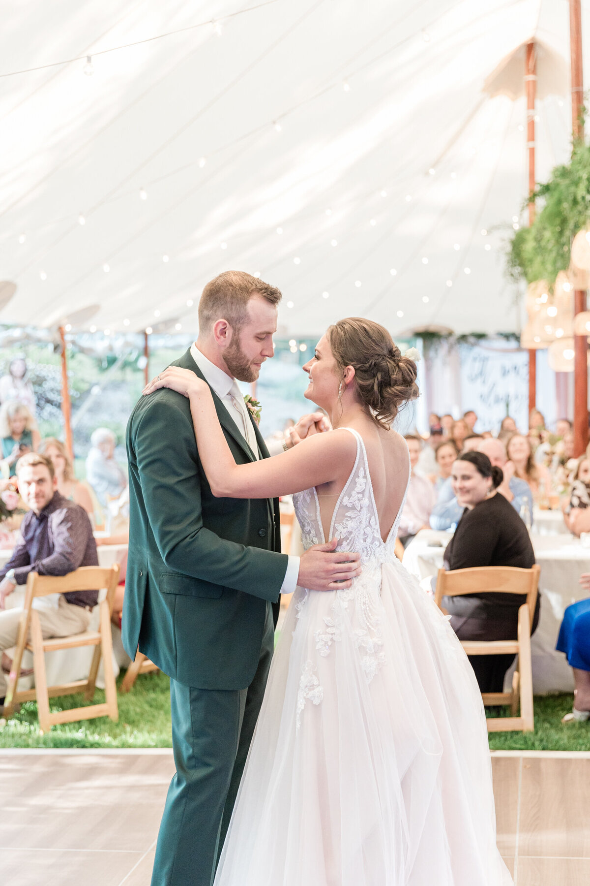 Couple shares their first dance at their garden wedding