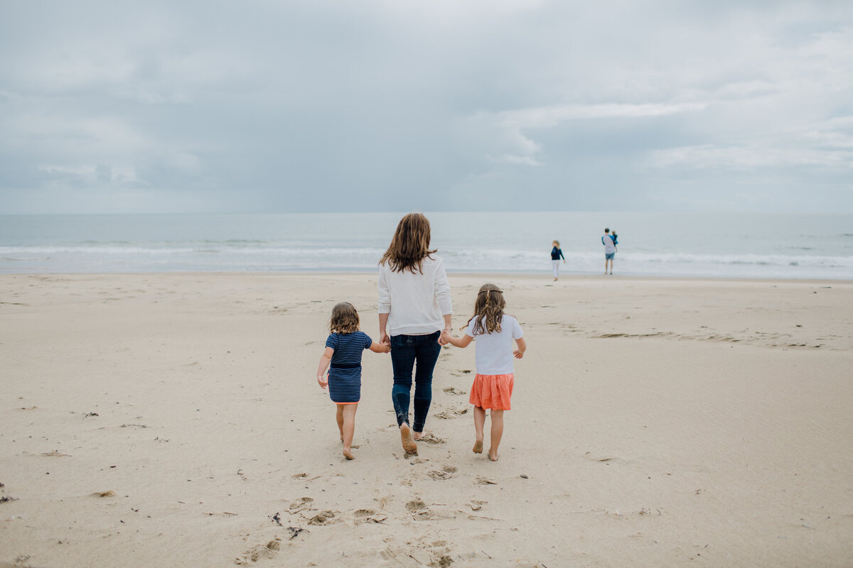 mum-and-daughters-walking-away-at-beach-wexford