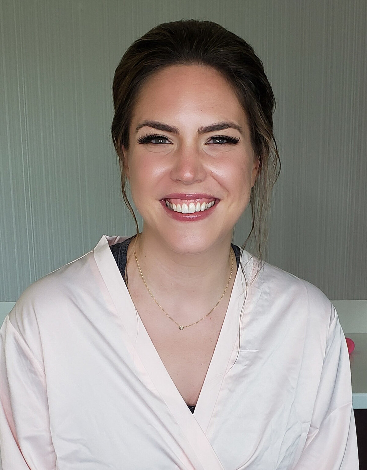 Close-up of a glowing bride with soft contour and peach tones – makeup by Lyds Makeup.