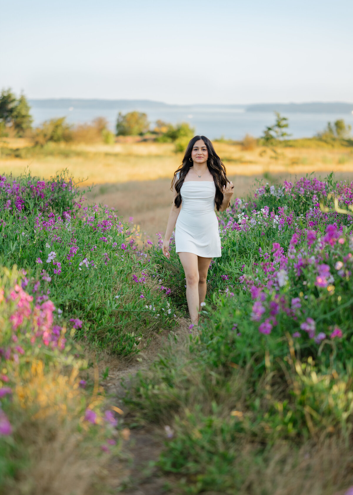 issaquah high school senior girl walking discovery park wildflowers