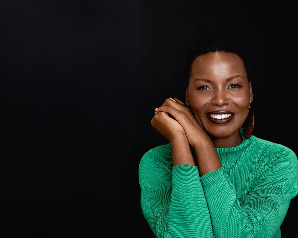 headshot of Marjorie Richard smiling with neutral background