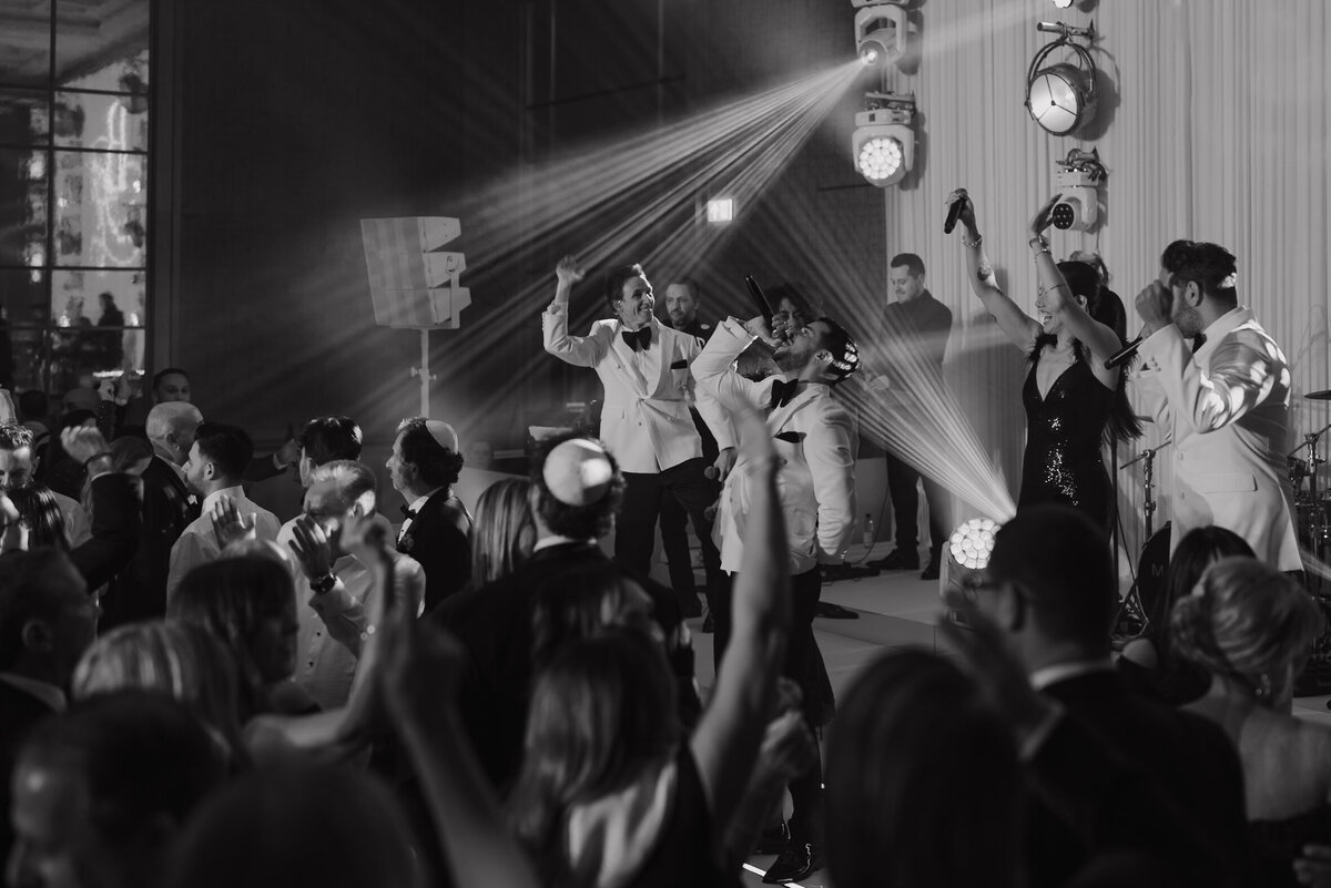 Wedding photographer captures couple taking a stroll hand in hand at their french chateau wedding.