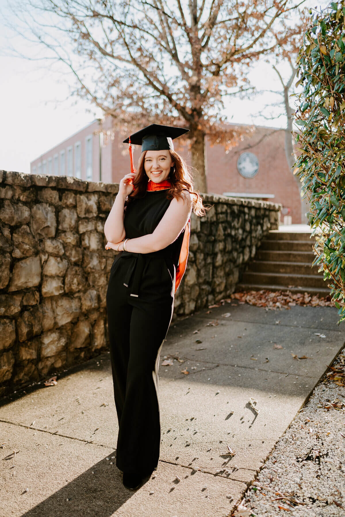 senior wearing cap and posing for senior photographers in nashville tn