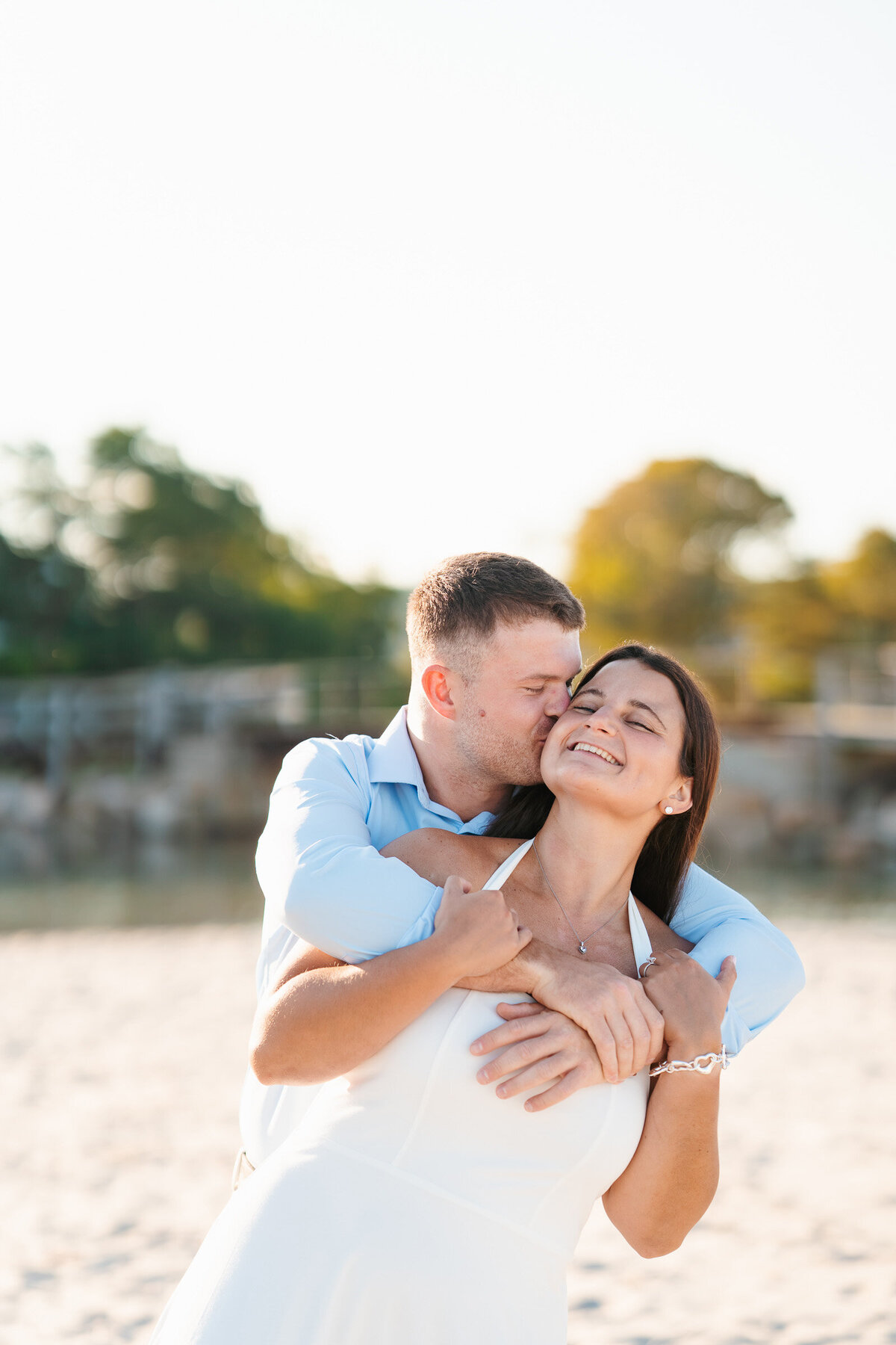 Massachusetts coastal engagement photographer capturing emotional portraits at Good Harbor Beach.
