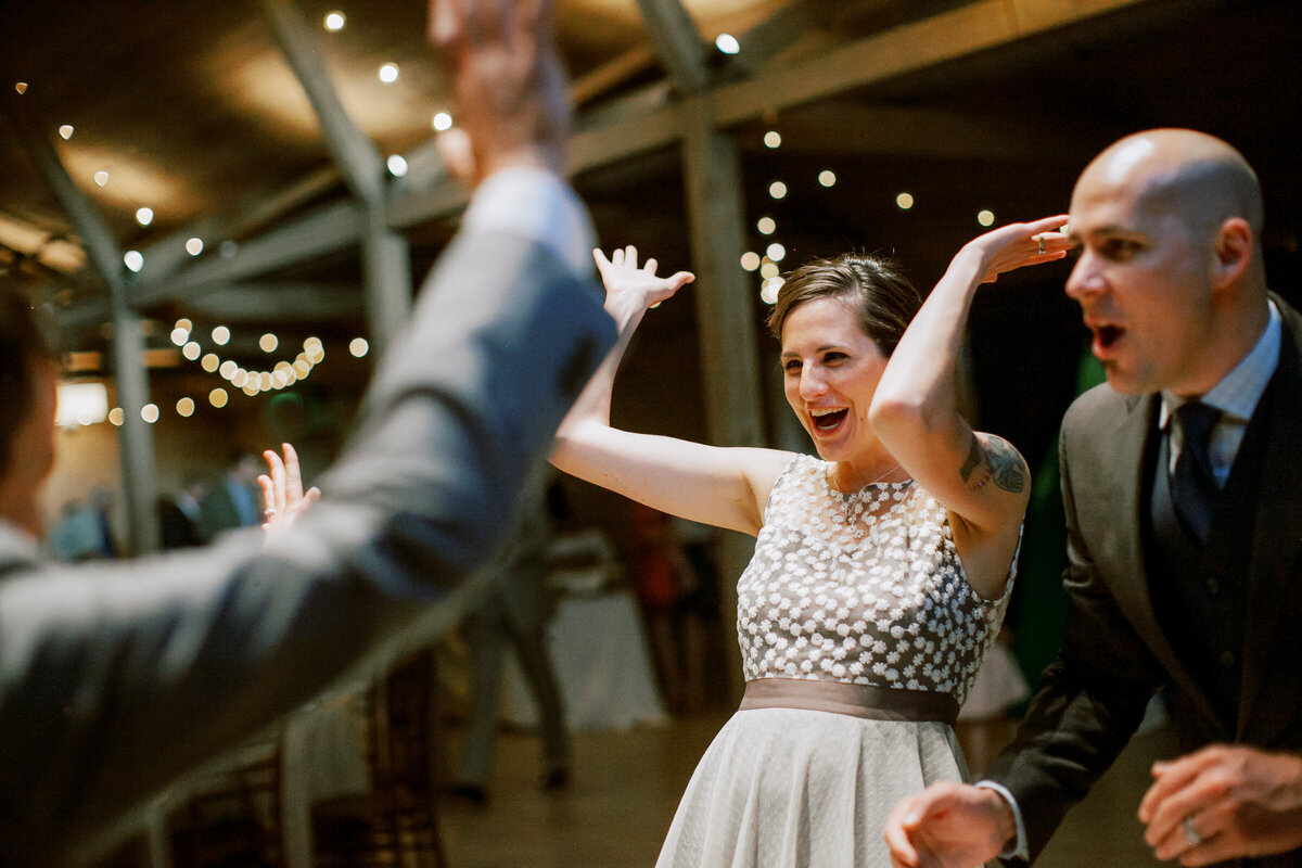 Wedding guest dances during a reception at Colorado's Barn at Raccoon Creek