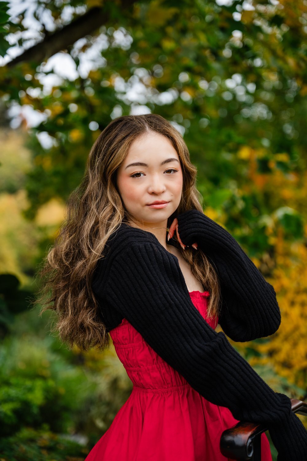 bellevue high school girl in red dress at fall garden