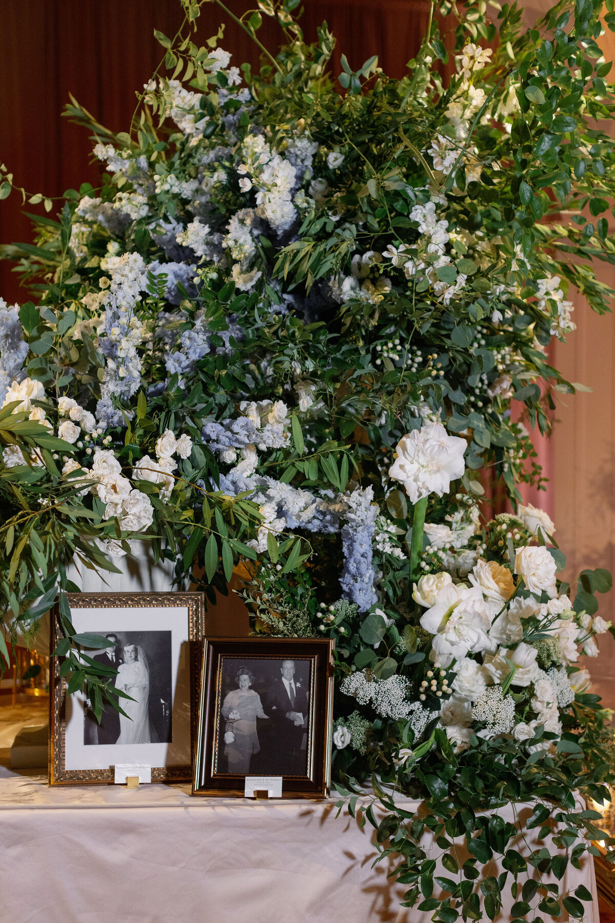 Close-up view of the floral arrangements and photos.