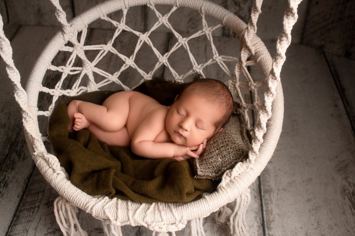 baby boy posed newborn session. in-studio newborn session in woodland, ca