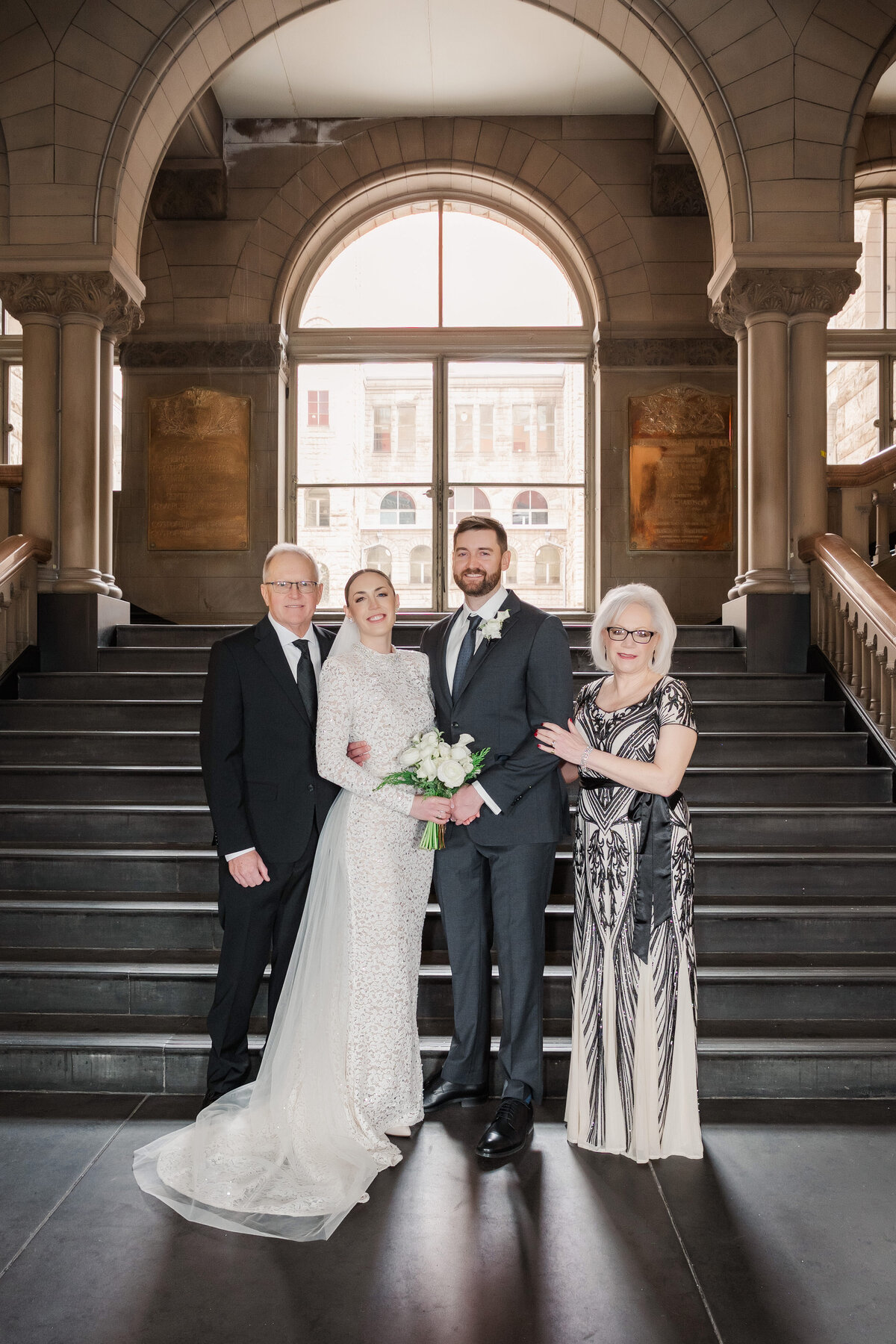 family photos on the staircase of allegheny county courthouse professional wedding photography by leeann marie