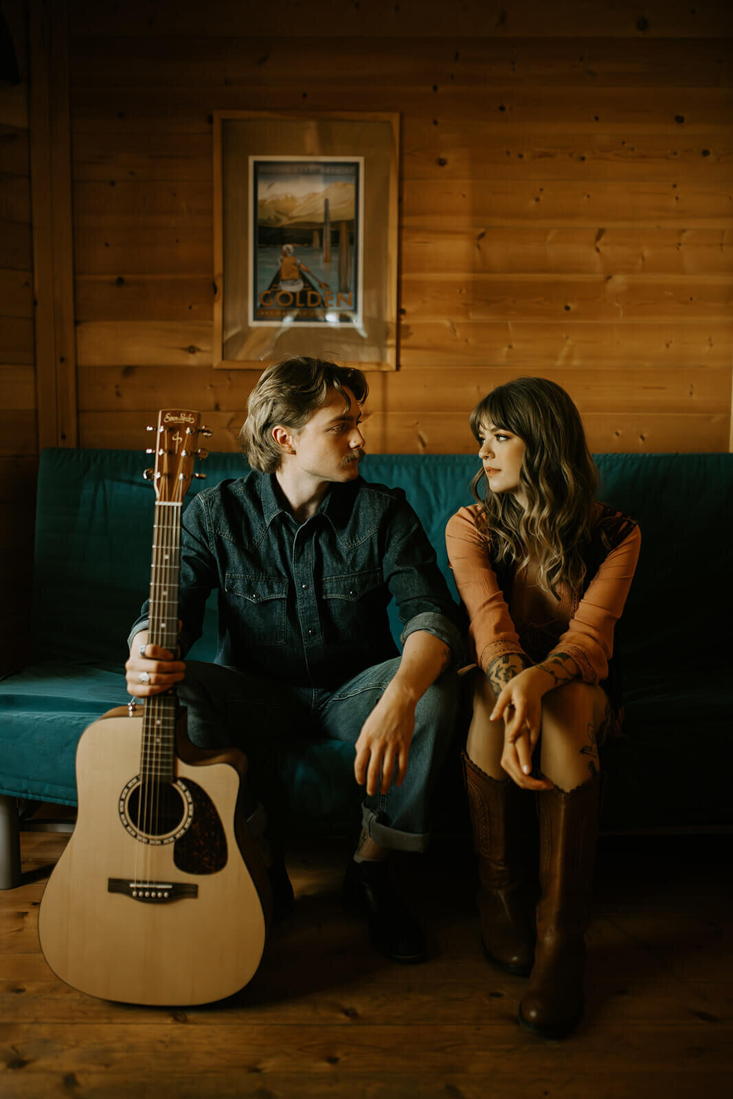 Man-holding-guitar-looking-at-woman